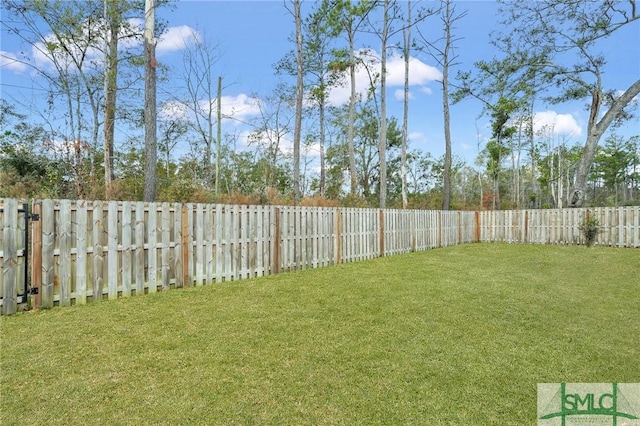 view of yard with a fenced backyard