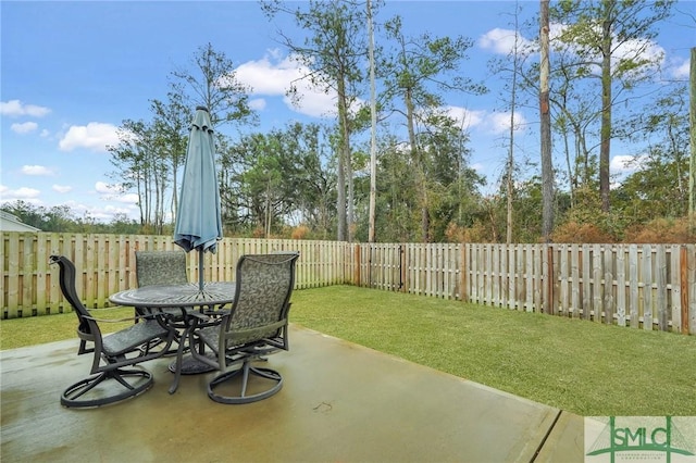 view of patio with outdoor dining area and a fenced backyard