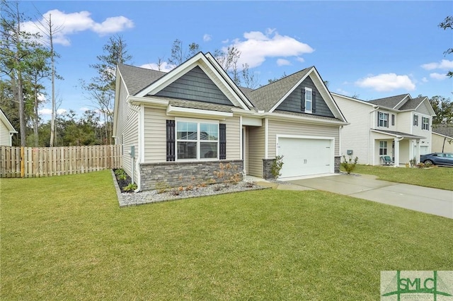 craftsman-style house with driveway, a front lawn, stone siding, and fence