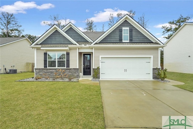 craftsman-style house with central AC unit, a garage, concrete driveway, stone siding, and a front yard