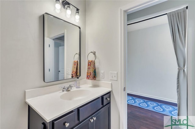 bathroom featuring vanity and wood finished floors