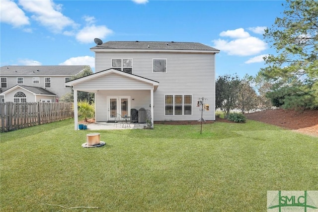 back of house with a yard, french doors, a patio, and fence