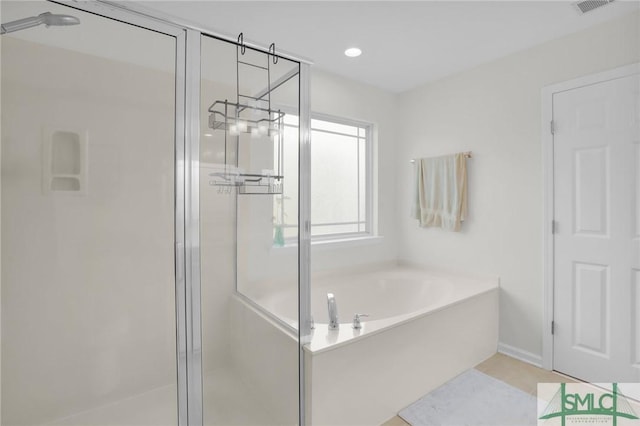 bathroom with a stall shower, a garden tub, visible vents, and recessed lighting