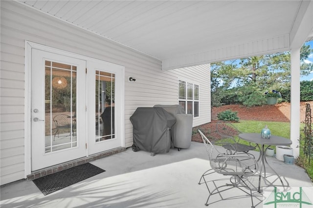 view of patio with grilling area and outdoor dining space