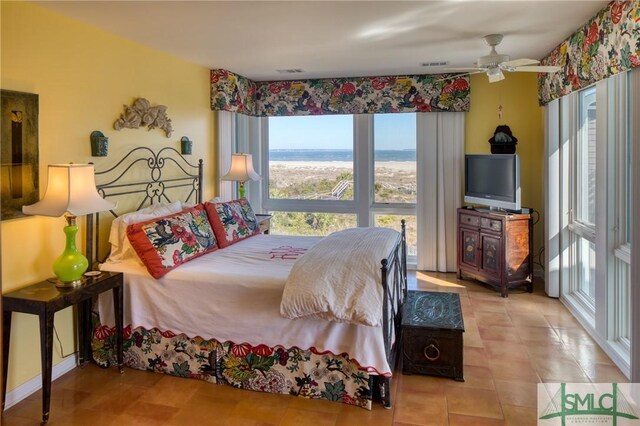 tiled bedroom featuring visible vents and a ceiling fan