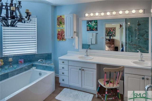 full bathroom with a garden tub, double vanity, and a sink