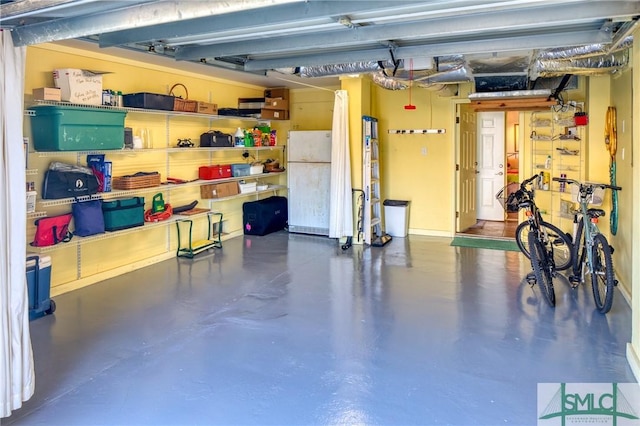 garage with freestanding refrigerator