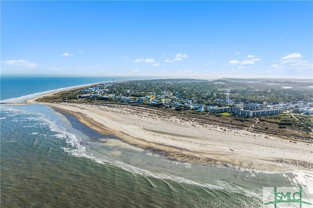 bird's eye view featuring a water view and a beach view