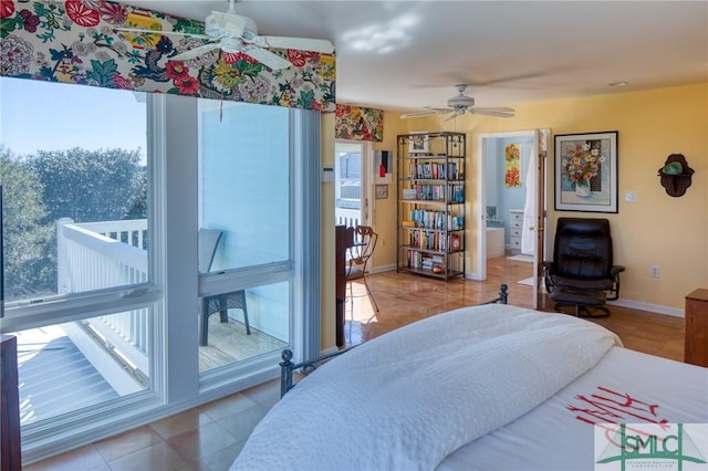 bedroom featuring tile patterned flooring, multiple windows, and baseboards