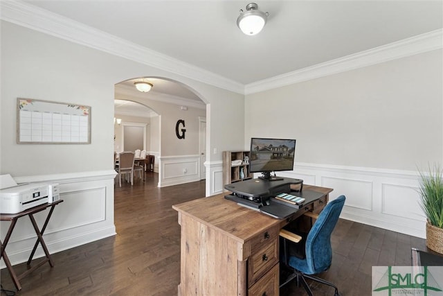 office area featuring crown molding, arched walkways, dark wood-style flooring, and wainscoting