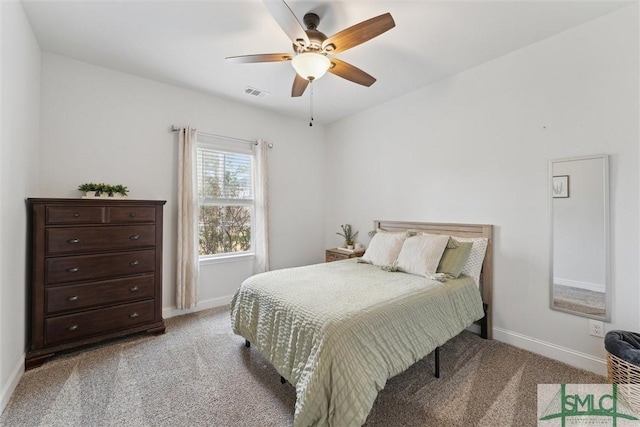 bedroom with baseboards, visible vents, and light colored carpet