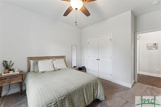 carpeted bedroom featuring a closet, a ceiling fan, and baseboards