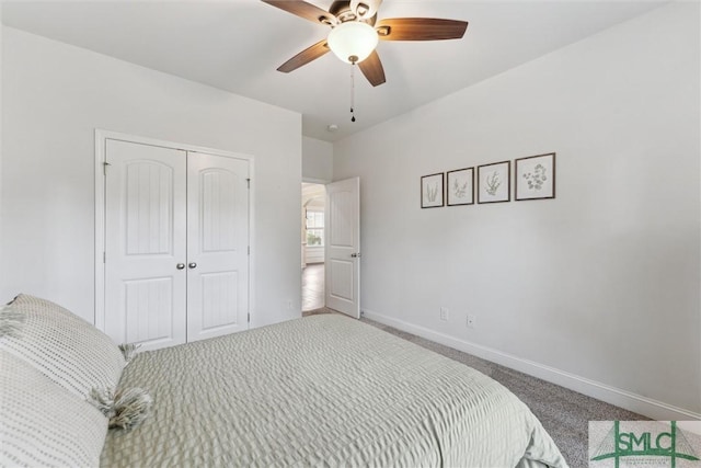 carpeted bedroom with a closet, a ceiling fan, and baseboards