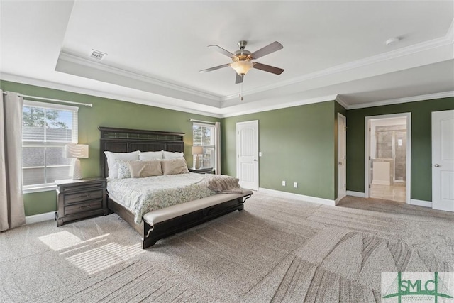 unfurnished bedroom featuring a raised ceiling, light colored carpet, visible vents, and baseboards