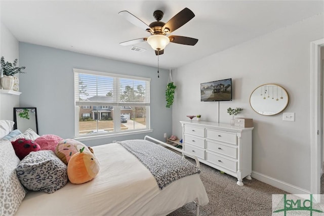 bedroom with a ceiling fan, carpet, visible vents, and baseboards