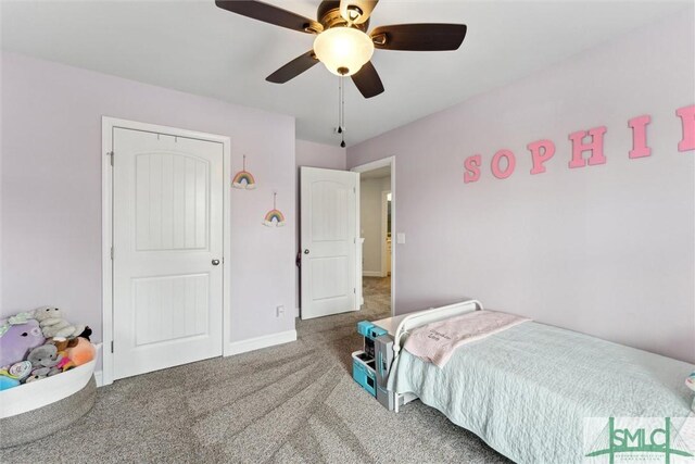 carpeted bedroom featuring ceiling fan and baseboards