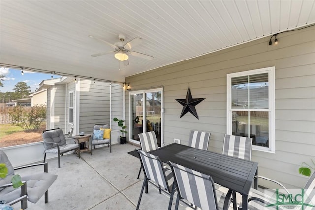 view of patio / terrace with outdoor dining area and a ceiling fan