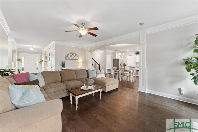 living room featuring dark wood-style flooring, visible vents, stairway, ornamental molding, and baseboards