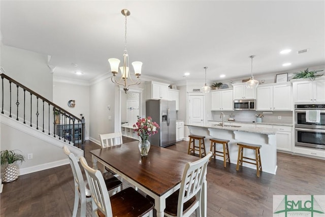 dining room with dark wood-style floors, crown molding, stairway, and baseboards