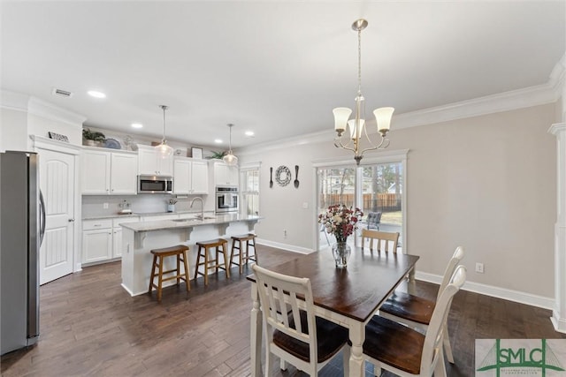 100 Timberland Trl, Richmond Hill, GA 31324 - dining space featuring ornamental molding, recessed lighting, dark wood-style flooring, a chandelier, and baseboards