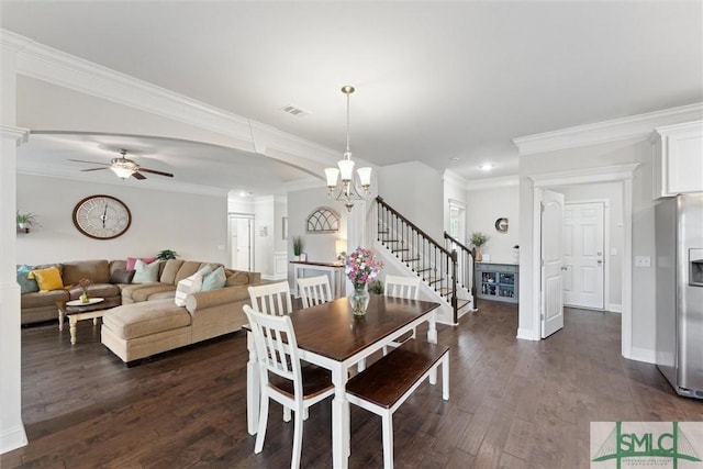 dining area with dark wood-style flooring, a fireplace, and crown molding