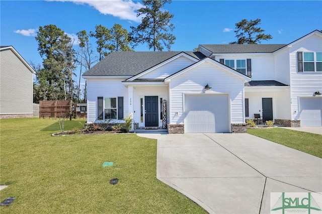 view of front of house with a garage, driveway, a front yard, and fence