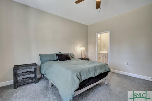 carpeted bedroom with ceiling fan, baseboards, and ensuite bathroom