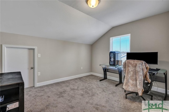 office area with vaulted ceiling, carpet flooring, and baseboards