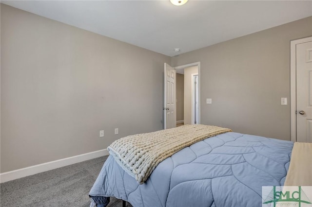 bedroom with carpet and baseboards