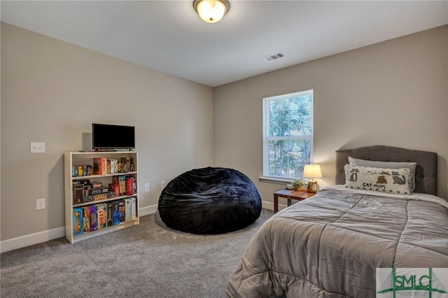 bedroom featuring carpet floors, visible vents, and baseboards