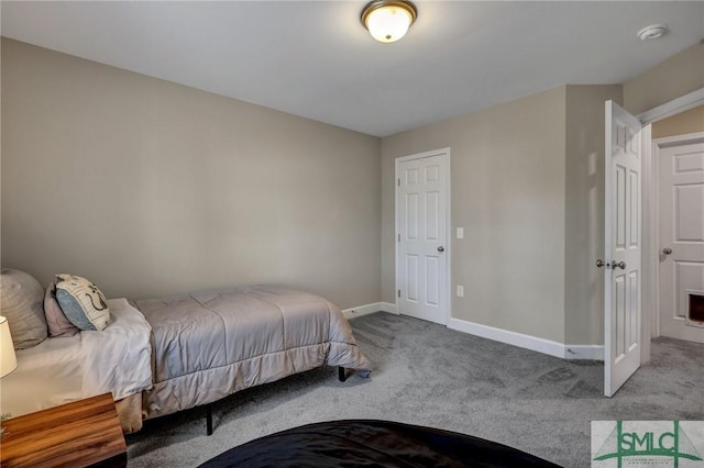 carpeted bedroom featuring baseboards