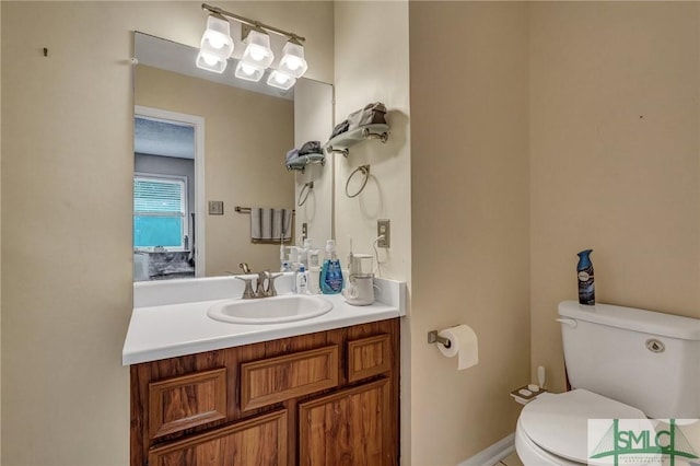 bathroom featuring vanity and toilet