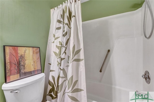 full bath featuring toilet and curtained shower