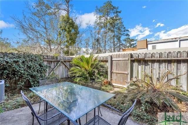 view of patio featuring outdoor dining area and a fenced backyard