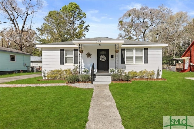 bungalow-style house with a front yard