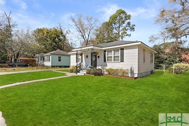 bungalow-style home featuring crawl space and a front yard