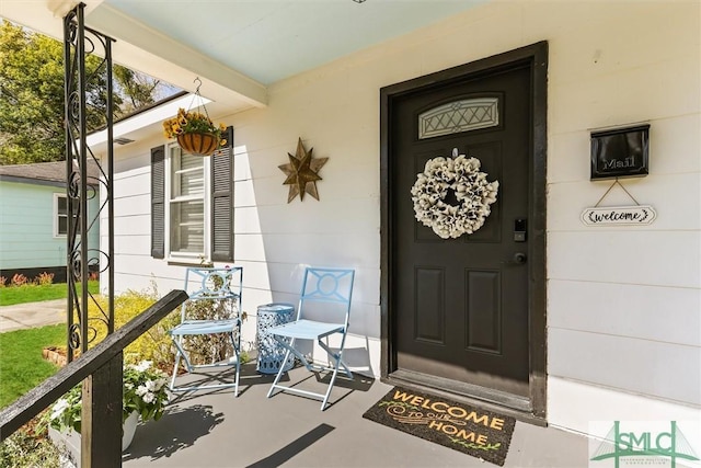 doorway to property with a porch