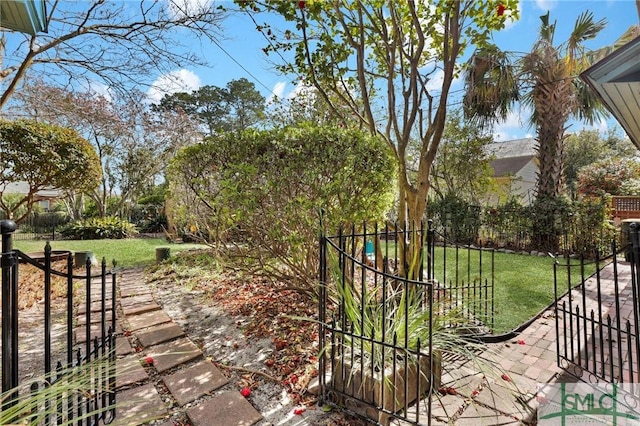 view of yard featuring a gate and fence