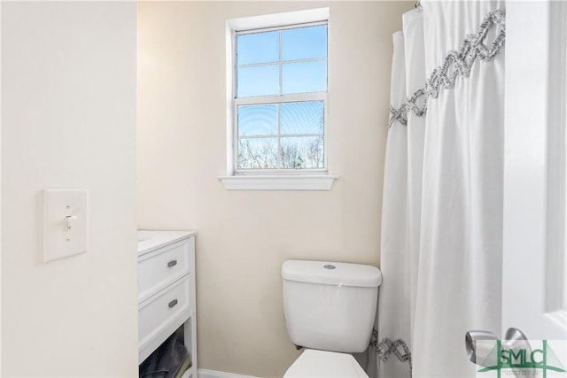 bathroom featuring toilet and vanity