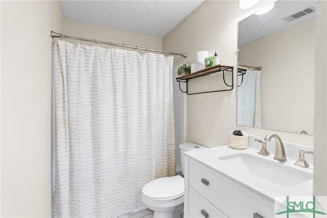 full bath featuring visible vents, toilet, vanity, and a shower with shower curtain