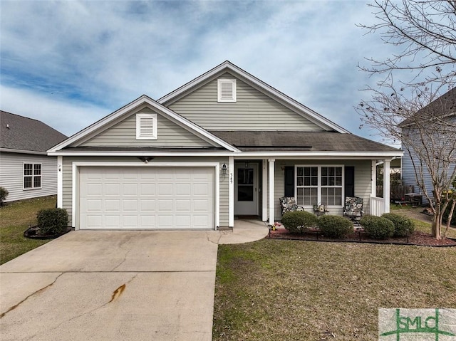 view of front of property with a garage, driveway, a porch, and a front lawn