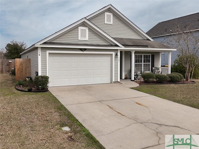 view of front of house featuring a porch, a garage, fence, concrete driveway, and a front lawn