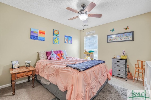 bedroom featuring a textured ceiling, light carpet, visible vents, and a ceiling fan