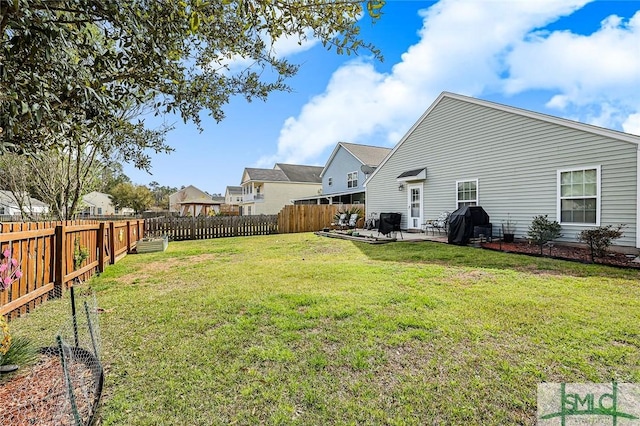 view of yard with a patio and a fenced backyard