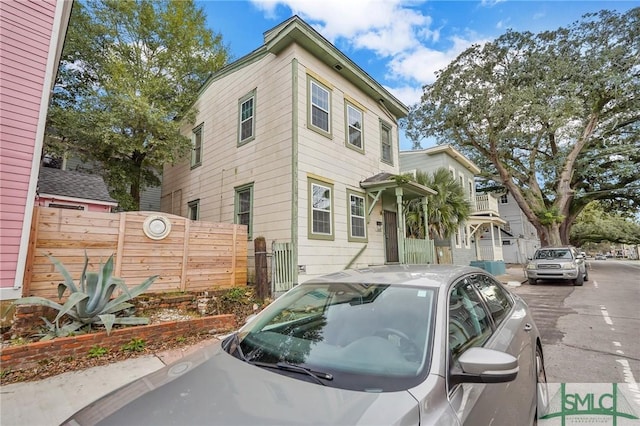 view of front of house with fence