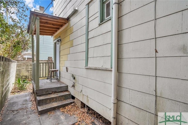 view of home's exterior featuring fence