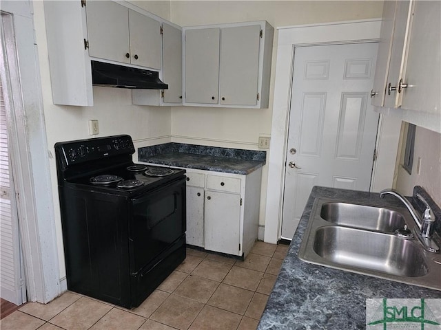 kitchen featuring light tile patterned flooring, under cabinet range hood, black range with electric stovetop, a sink, and dark countertops