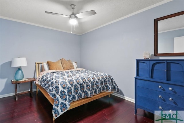 bedroom with baseboards, a textured ceiling, ornamental molding, and wood finished floors