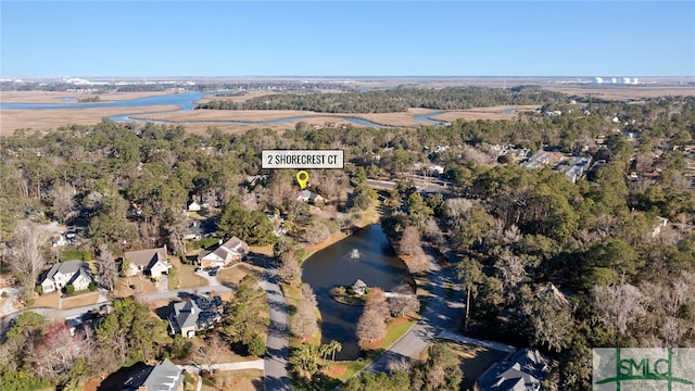 aerial view featuring a wooded view