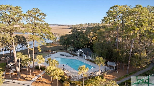 community pool featuring a patio and fence